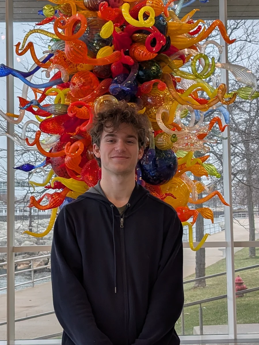 Keith Megaridis in front of a Chihuly glass sculpture at the Milwaukee Art Museum.
